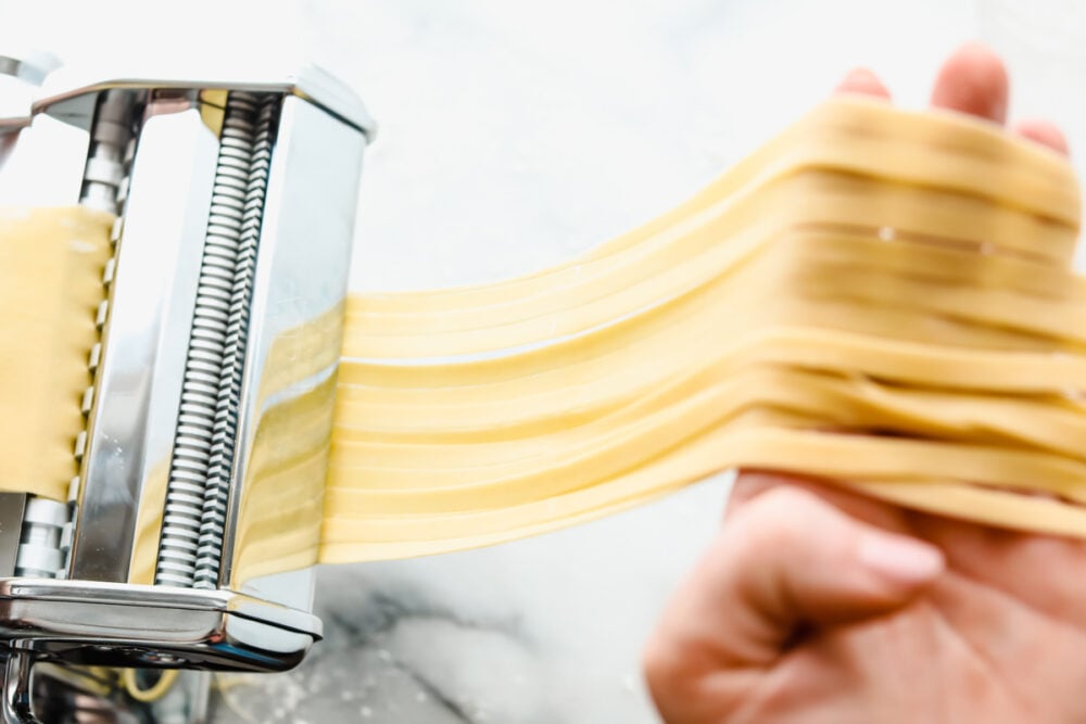 Homemade pasta is a labor of love but it is totally worth the extra work. This pasta is simple and easy, it just takes a bit of time Cutting the dough into long strands for cooking.