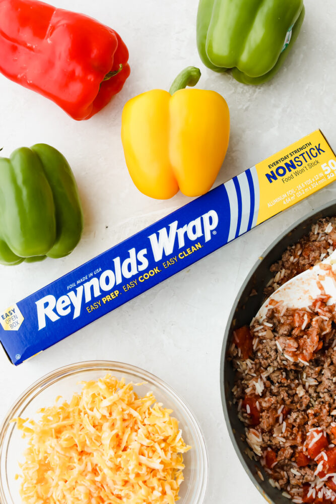 Stuffed bell peppers are filled with lean ground beef, rice, tomatoes, and the perfect blend of seasonings all topped with shredded cheese. Individually wrapped peppers make a colorful and delicious dinner with a beef combination full of flavor.
