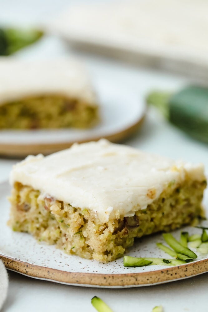 Zucchini Bars with Brown Butter Frosting is deliciously moist and absolutely heavenly. This is one of the best ways to use up those extra summer zucchini. Zucchini bars cut into squares.