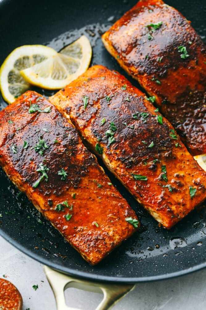 Easy and Amazing Blackened Salmon is a foolproof way to cook restaurant-worthy salmon at home! The salmon is tender and flakey and packed with flavor that is going to wow your taste buds! Blackened Salmon in a pan seared to perfection.
