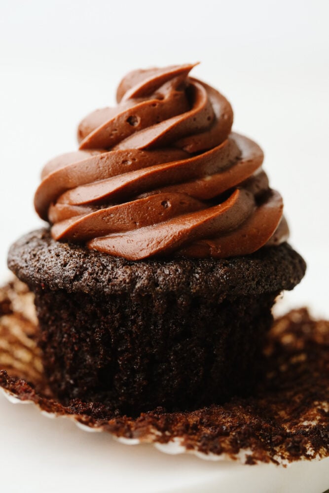 For treats that are incredibly moist, fudgy, and delicious, this is your go-to recipe! Topped with smooth chocolate buttercream, these chocolate cupcakes are a classic dessert your friends and family will go crazy over. One chocolate cupcake, frosted.