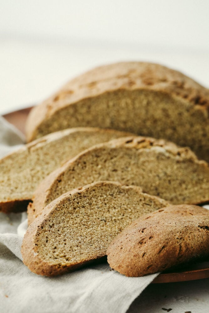 Rye Bread is a soft light loaf of heavenly flavor and a crust that's to die for! Super easy and wholesome, you and your loved ones are going to love this homemade bread! Slices of rye bread ready to eat.