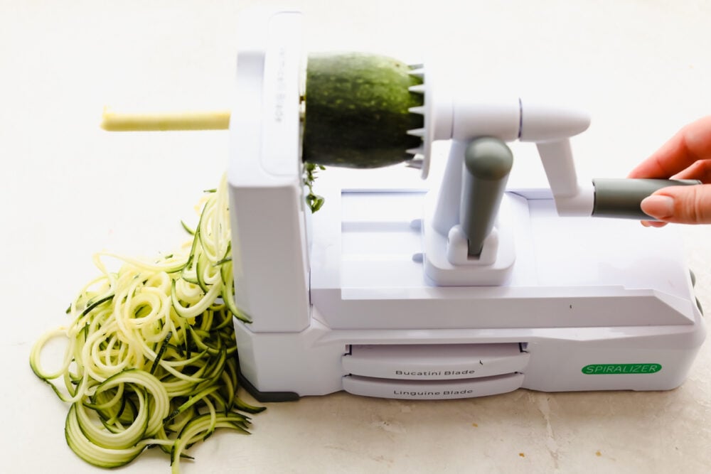 Zucchini noodles are the perfect low-carb option for pasta night. Use these 3 cooking methods to add a little healthy goodness to dinnertime! Using a spiralizer to prepare zucchini noodles.