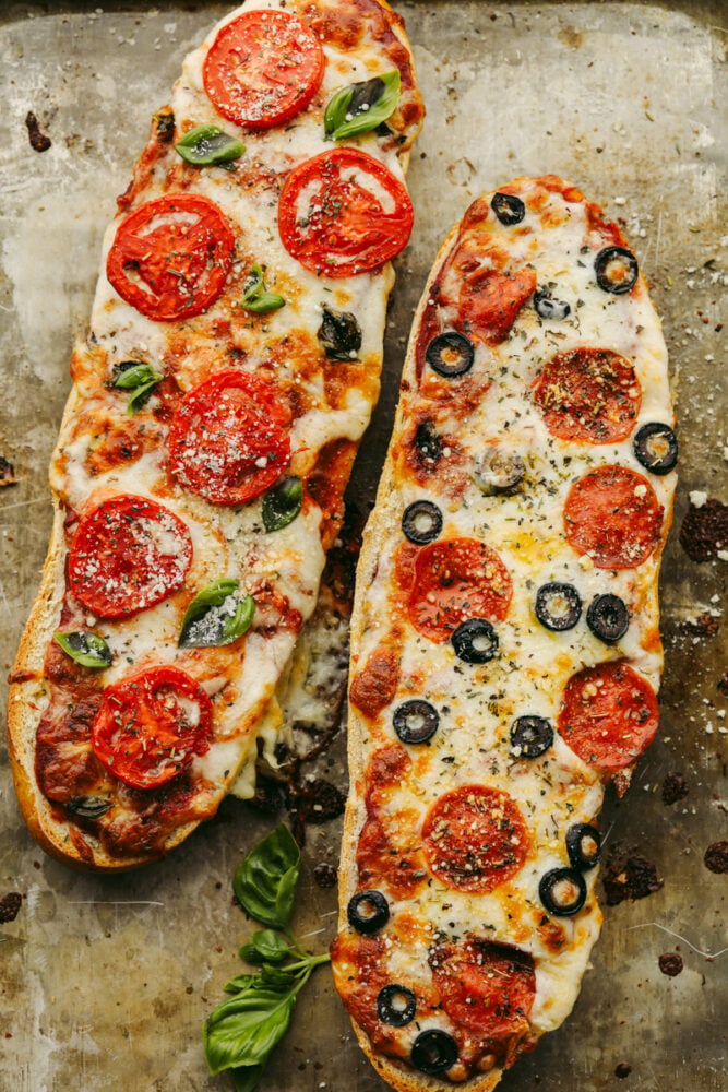 French bread pizza is quick, easy, AND delicious! Topped with all of your favorite things, this simple pizza delivers amazing taste! It's definitely a winner! 2 loaves of French bread pizza with different toppings.