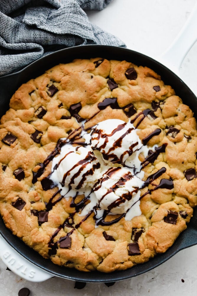 This ooey-gooey skillet cookie brings homemade cookies to the next level! It is warm, sweet and the chocolate just melts right in your mouth! You definitely won't be able to stop at just one bite! A skillet cookie.