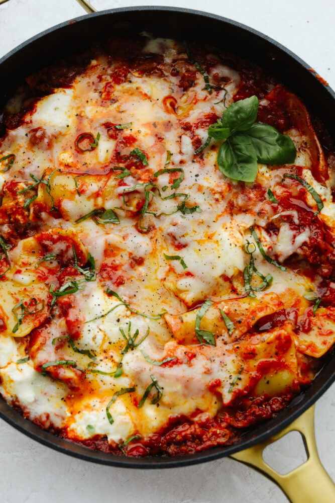 Skillet lasagna is the absolute best comfort food! It is so full of flavor that creates that authentic Italian taste. It is quick and easy and a family favorite that you MUST try! Skillet lasagna in a pan, ready to eat.