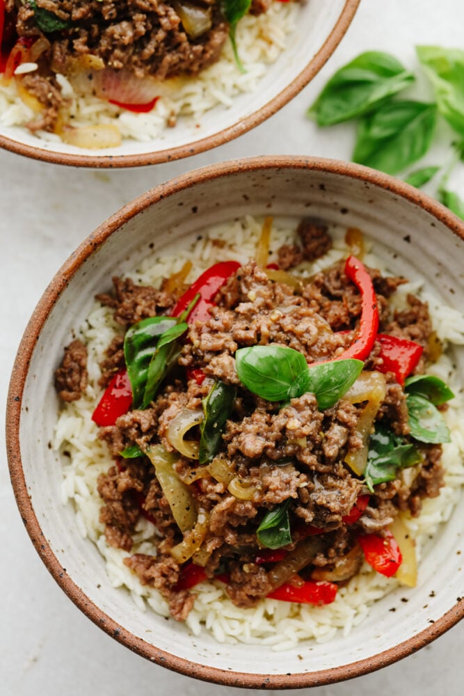 Thai basil beef is simple and delicious! It's made with a homemade Thai sauce that has a bold and brilliant flavor and can be thrown together in less than 30 minutes. It is SOO GOOD! Top view of Thai basil beef in a bowl.