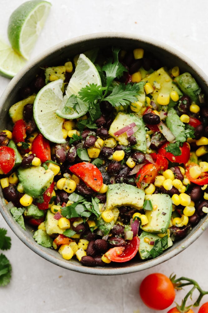 Black bean and corn salad is loaded with tons of flavor and amazing and fresh ingredients! It is the perfect choice for lunch, a side dish, or even an appetizer! Close up of black bean and corn salad.