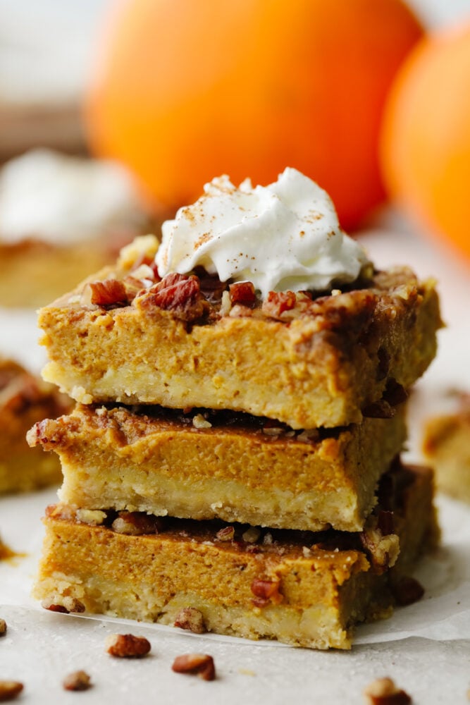All of the goodness of fall treats combine in these delicious pumpkin pecan pie bars. Layers of shortbread, pecan, and spiced pumpkin will have you hooked!