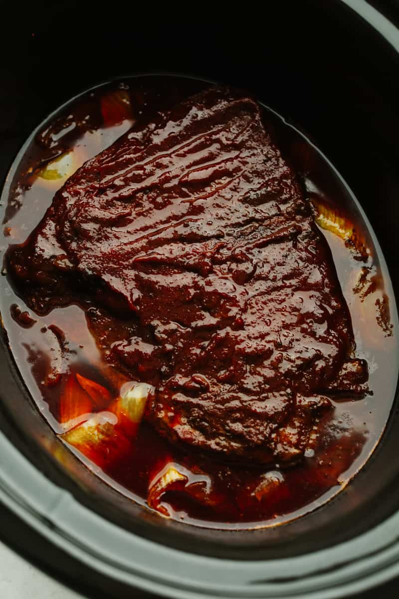 This Slow Cooker Beef Brisket is melt-in-your-mouth tender, packed with flavor, and practically cooks itself. Perfect for easy family dinners or feeding a hungry crowd! Finished slow cooker beef brisket.