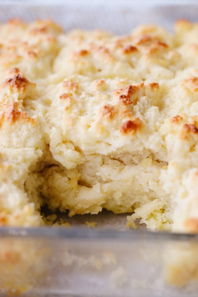 These swim butter biscuits are soft and fluffy on the inside with a crisp outside edge. They are SOO GOOD and will go with just about anything! A close up of swim butter biscuits in a pan.