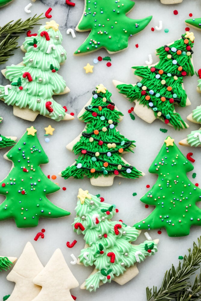 If you're wanting a dessert that is both festive and delicious, look no further! These Christmas tree sugar cookies will shine at any holiday party! A variety of Christmas tree cookies.