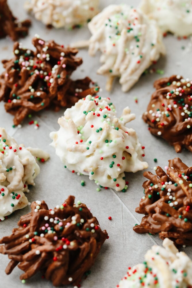 Haystack cookies are perfect for the holidays! They are festive, have the perfect crunch, and are so good that you won't be able to stop at just one! No bake haystack cookies with sprinkles.