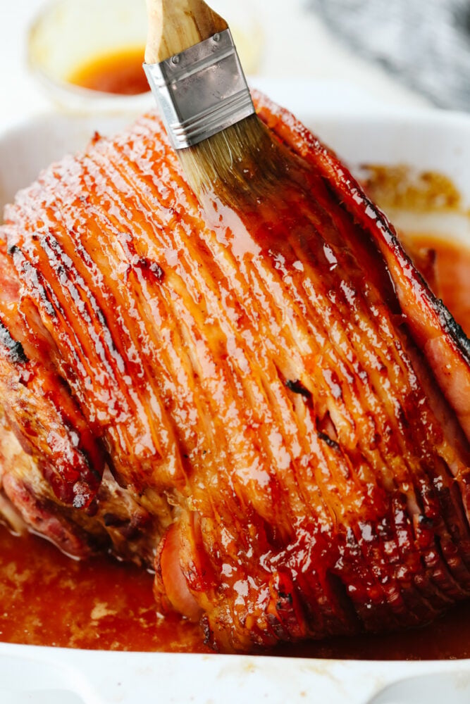 If you are looking for the perfect ham to be the star of your Christmas dinner, this apricot glazed ham is it! It has a delicious apricot glaze drizzled on top and it's baked to perfection. An apricot glazed ham right out of the oven.