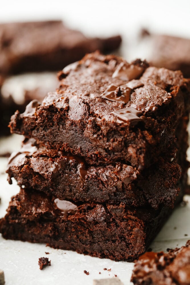 These flourless chocolate brownies are absolute heaven! The thin, chewy texture and sweet flavor are so delicious that I bet that you can't just stop at one! A stack of flourless chocolate brownies.