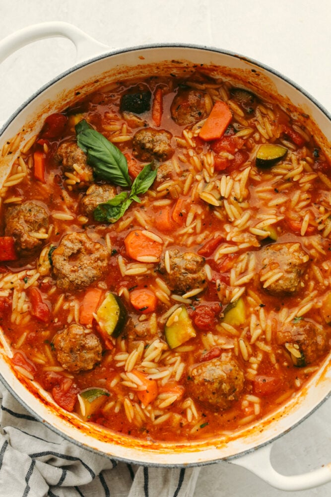 This meatball soup is hearty and full of amazing flavor. This only takes about 30 minutes to cook up and can be made with homemade or frozen meatballs! It's a MUST TRY recipe for sure! A pot of meatball soup.