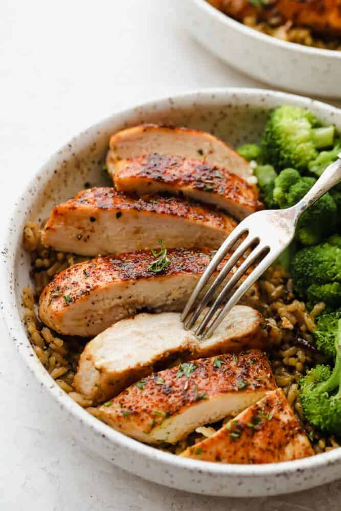 ade with delicious herbs and savory flavors, this chicken seasoning will make any piece of chicken taste absolutely incredible! It takes any chicken recipe to the next level. You will never buy store-bought seasoning again! A bowl of cooked chicken and broccoli with a fork sticking into a piece of chicken.