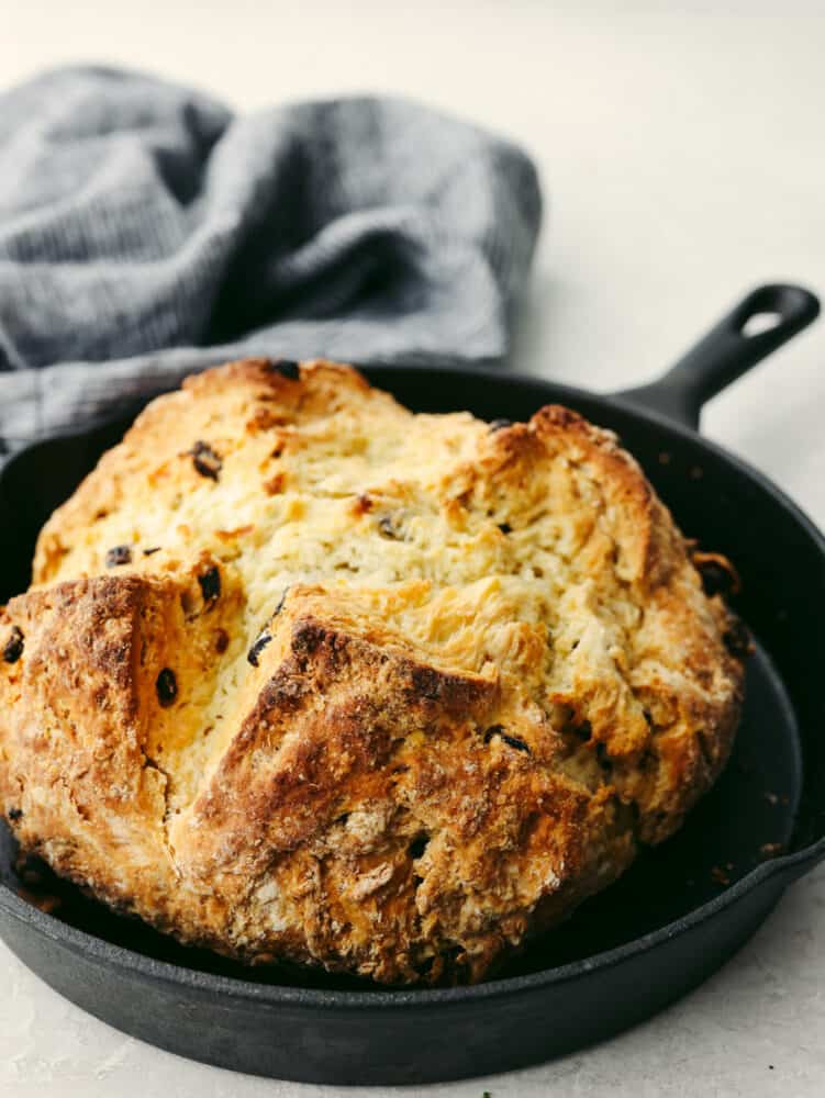 This traditional no yeast bread recipe is a crumbly dense bread with a slightly sweet taste. With only a few pantry and refrigerator staples required, this delicious traditionalย soda bread can be made easily and is one everyone will enjoy. Soda bread all baked in a skillet pan.