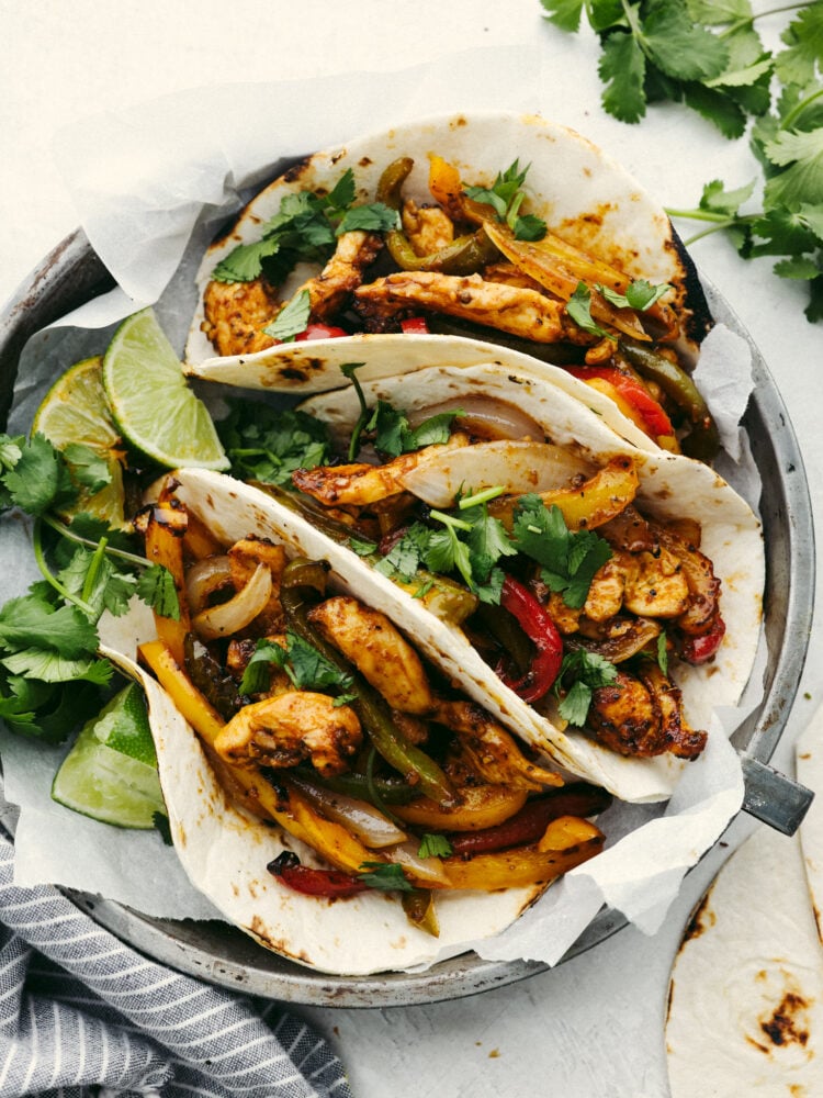 These air fryer fajitas are packed to the brim with flavor but only take a few minutes to make! They are perfect for those on-the-go, busy nights, and everyone will go crazy over them! Chicken fajitas in homemade flour tortillas.