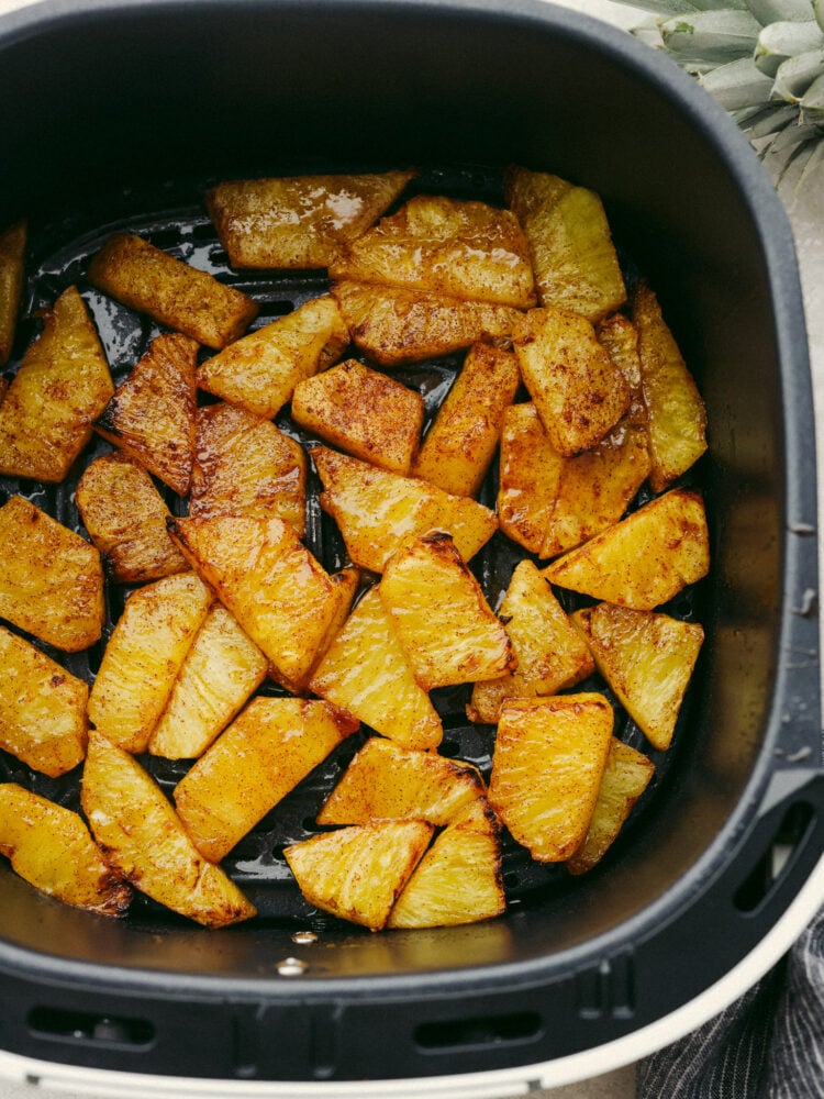 This amazing air fryer brown sugar pineapple is the easiest and most delicious snack! So juicy and sweet, this warm pineapple will become your new favorite way to eat this tropical fruit! Brown sugar pineapple in an air fryer.
