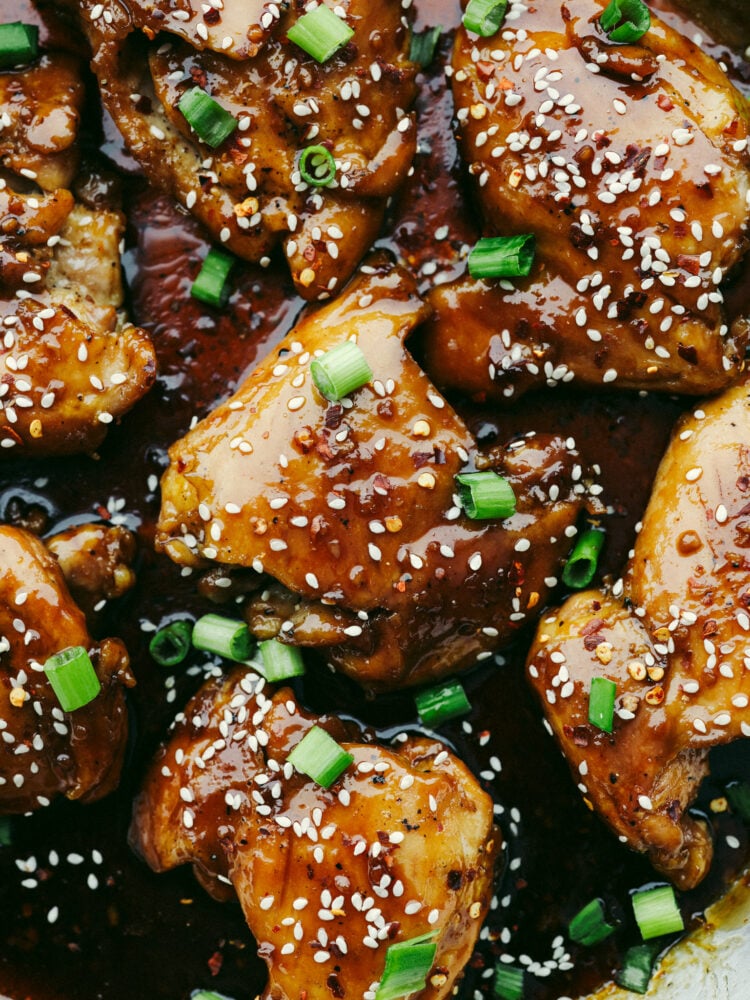 My Sticky Asian Glazed Chicken is one of those dinners I keep coming back to. Itโs sweet, a little savory, and full of flavorโbut honestly, itโs the caramelized glaze that seals the deal. It's SO GOOD! Close up shot of sticky Asian glazed chicken.