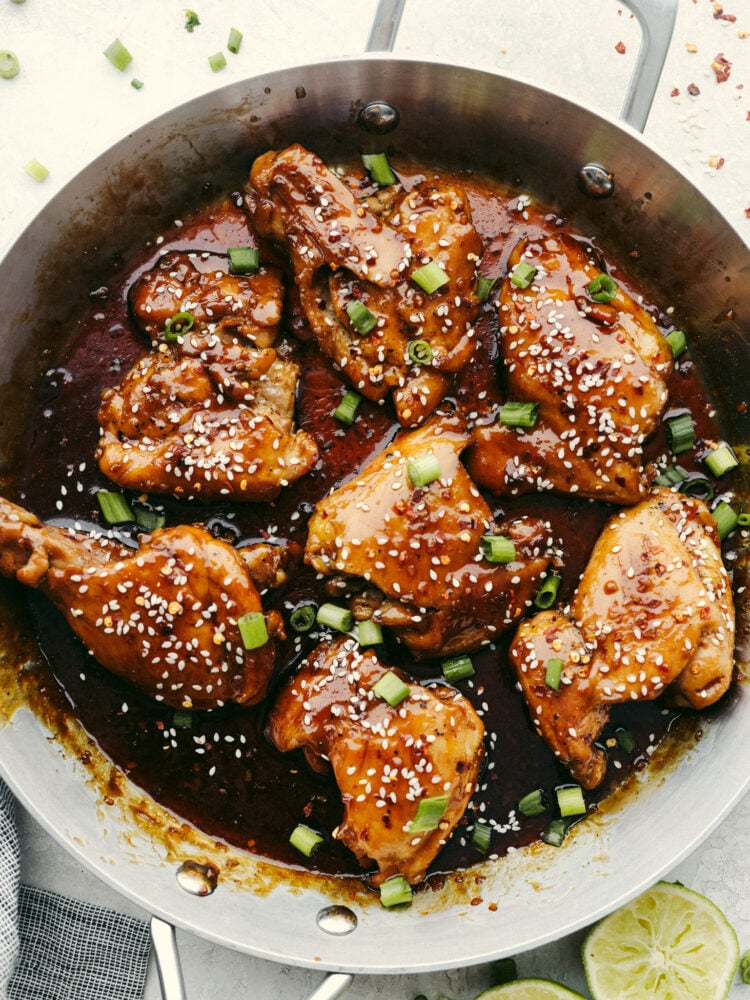 My Sticky Asian Glazed Chicken is one of those dinners I keep coming back to. Itโs sweet, a little savory, and full of flavorโbut honestly, itโs the caramelized glaze that seals the deal. It's SO GOOD! Overhead shot of sticky Asian glazed chicken in a skillet.