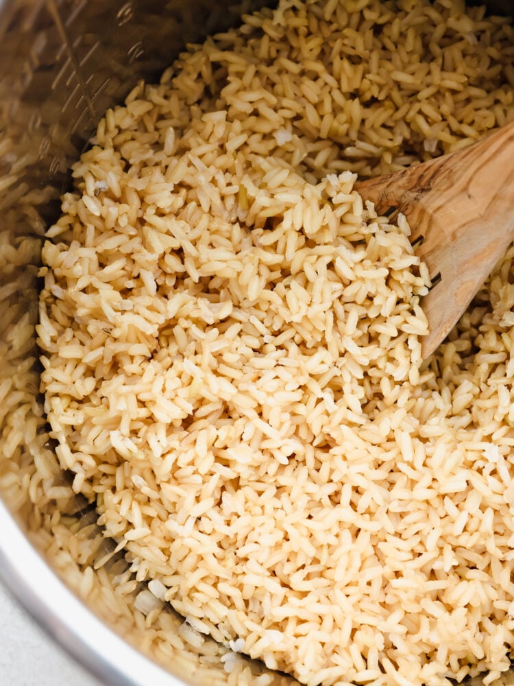 Brown rice can be tricky to get right. Make it in your Instant Pot and you'll have fresh, fluffy rice ready in 20 minutes! Closeup of Instant Pot brown rice.