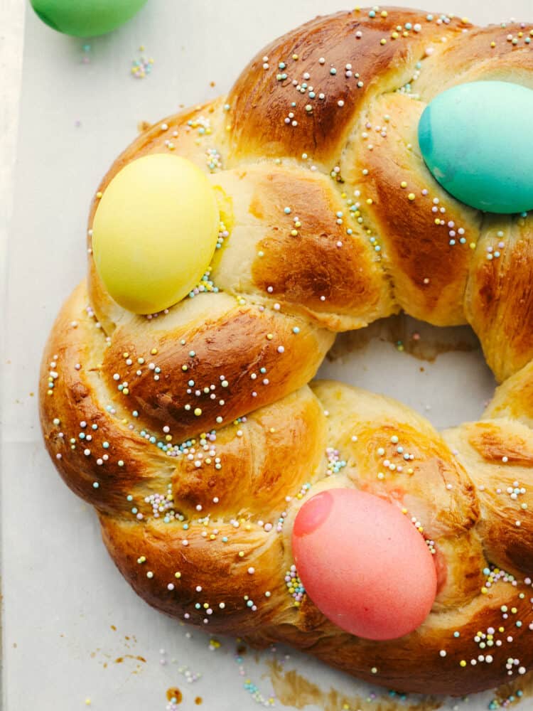 Easter bread is fluffy, sweet, and almost too cute to eat! This festive bread is sure to be a hit with its soft, tender texture and colorful presentation! Closeup of Easter bread.