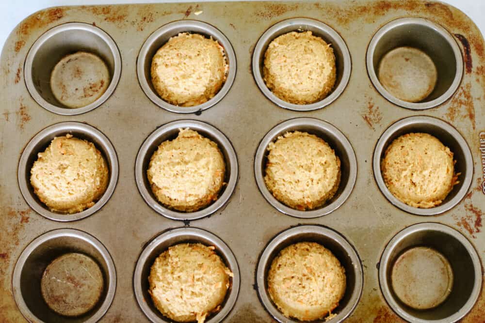 Pupcakes are a dog-friendly dessert your 4-legged friend will go crazy over! They're super easy to make and full of healthy ingredients for your pup! Top-down view of pupcake batter in a muffin tin.