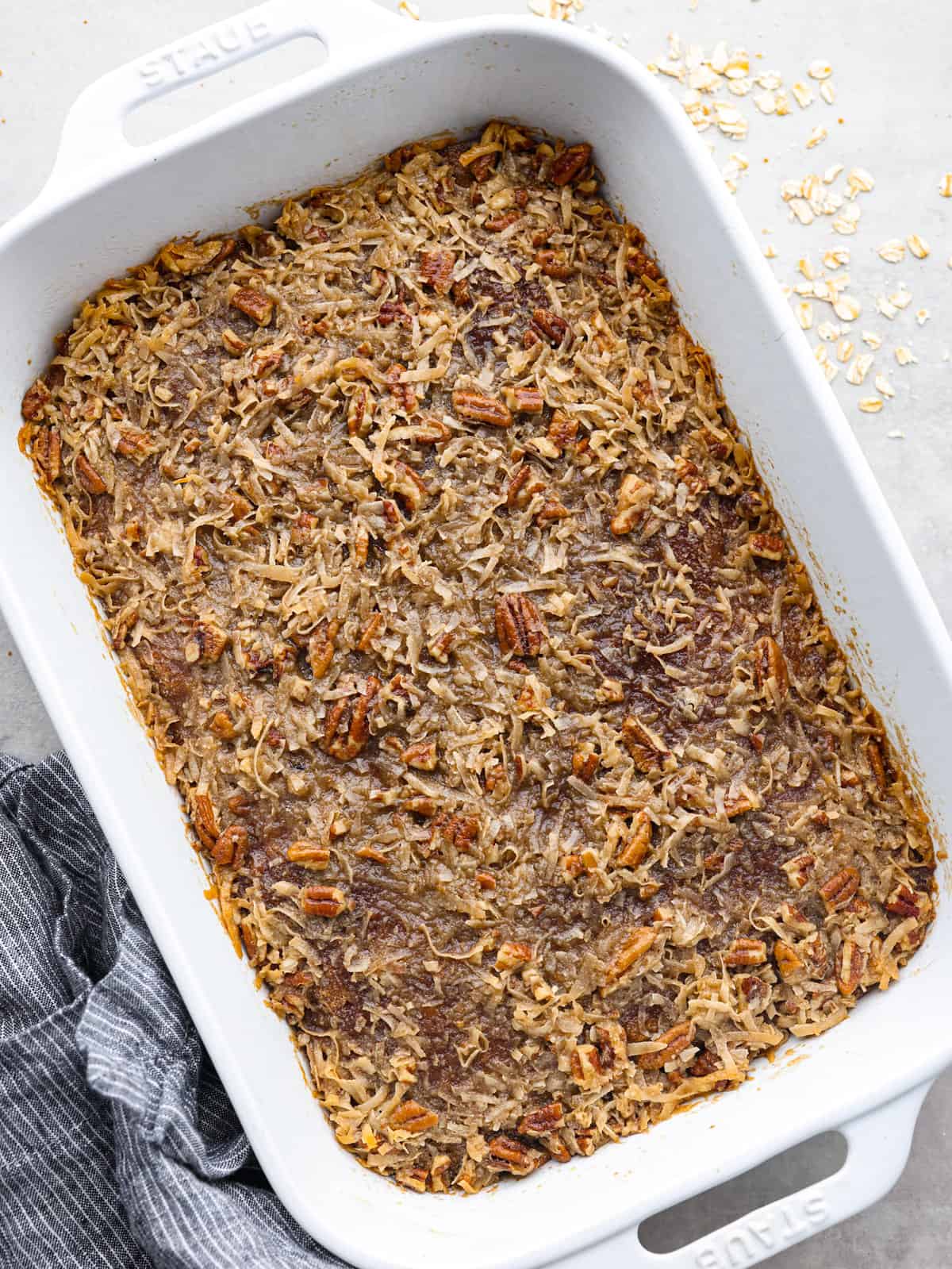 You have to make this oatmeal cake. Itโs an old-school recipe that doesnโt look like much, but that buttery pecan and coconut topping? Itโs gooey, crunchy, and totally addictive! Cake comlpeted and frosting broiled.