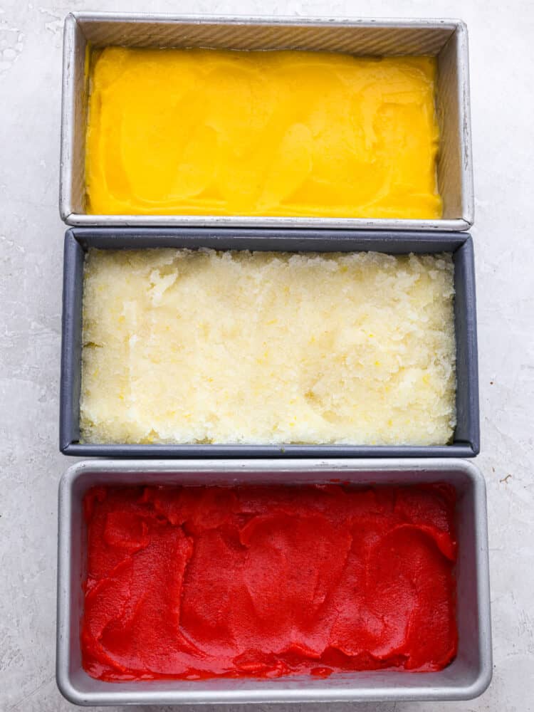 Get ready for the most refreshing homemade sorbet that you have ever had with this perfect recipe! Silky smooth, packed full of flavor, and a delightful dessert for any occasion, this will knock your socks off! 3 different flavors of homemade sorbet frozen in bread tins.