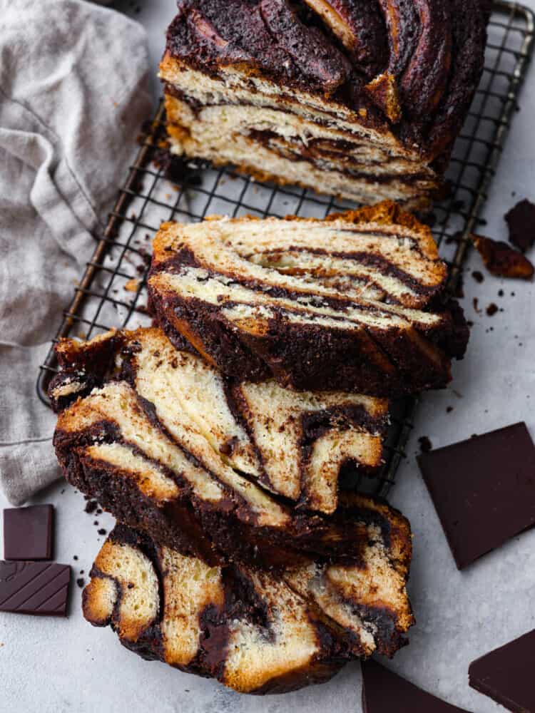 Youโre not going to be able to get enough of this soft, sweet babka bread filled with luscious chocolate! With its beautiful swirled interior, it looks as good as it tastes! Top-down view of sliced babka bread.