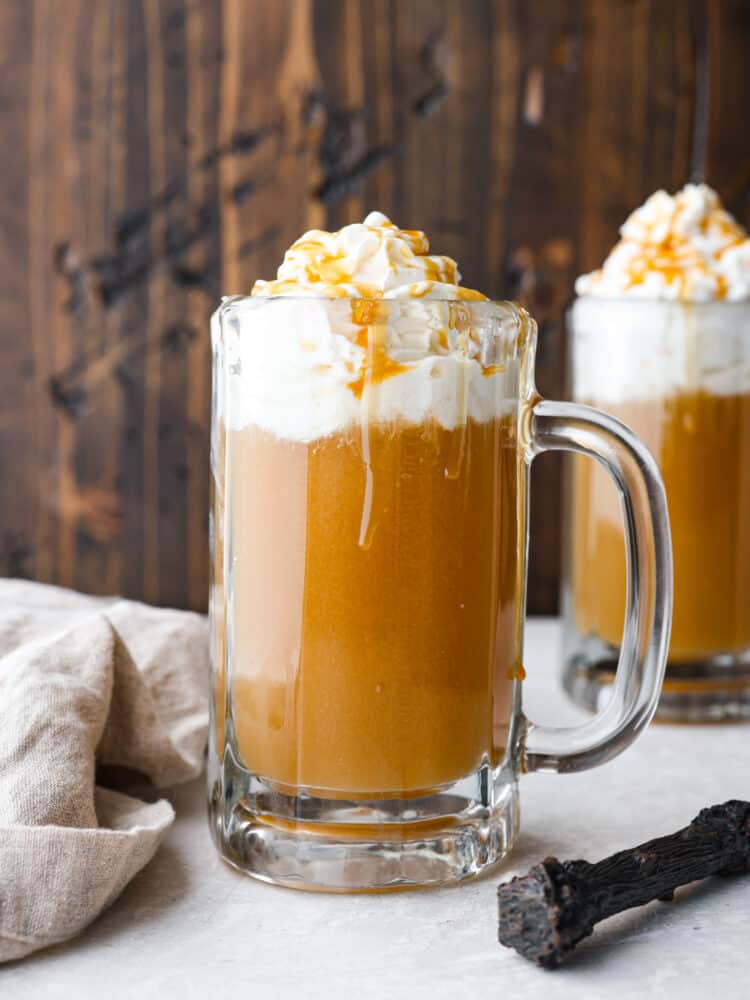 Bring the magic of the wizarding world to your home with a glass of this delectable homemade butter beer! With creamy, butterscotch flavor and whipped cream topping, everyone in your family will be wanting a refill. Butter beer in a glass mug, topped with whipped cream and caramel drizzle.