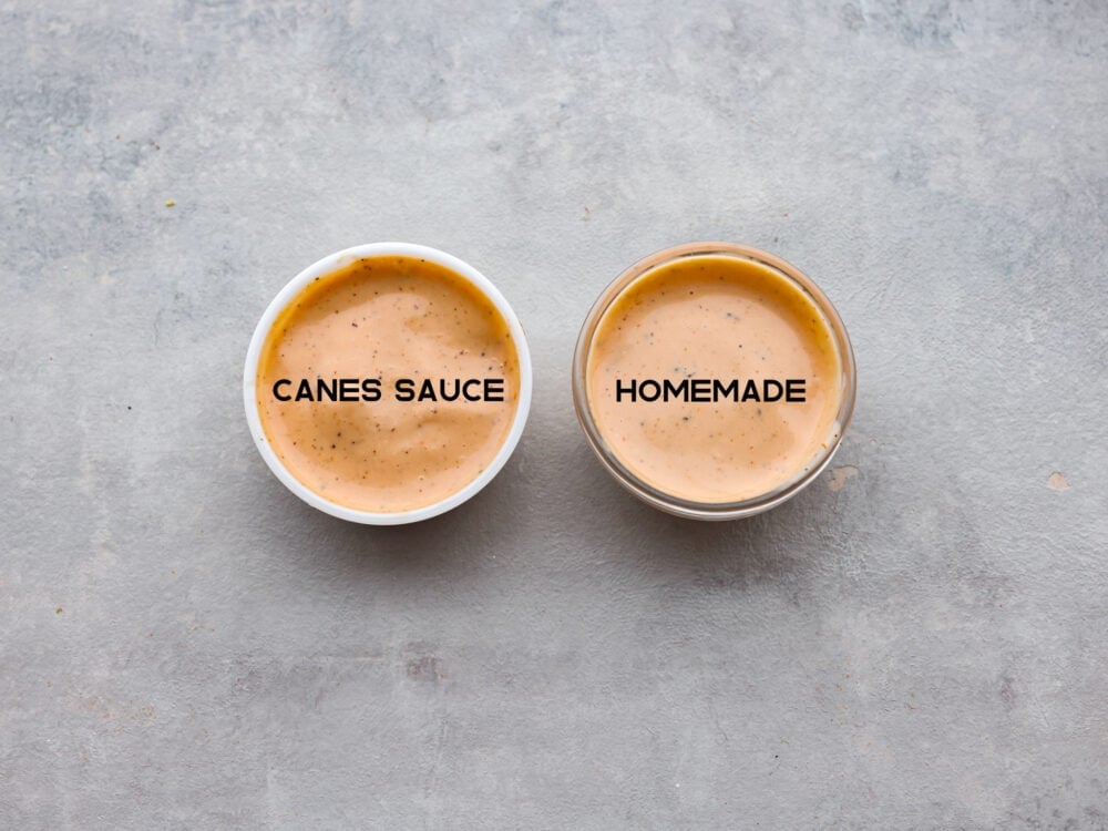 The popular cane's sauce from Raising Cane's restaurant can be made at home with this identical copycat version. This creamy and tangy dipping sauce is packed with savory smoky flavors perfect for chicken, fries, or as a burger spread. A close up side by side view of the restaurant sauce in one bowl, and homemade sauce in another bowl. The colors and size of the bowls are identical.