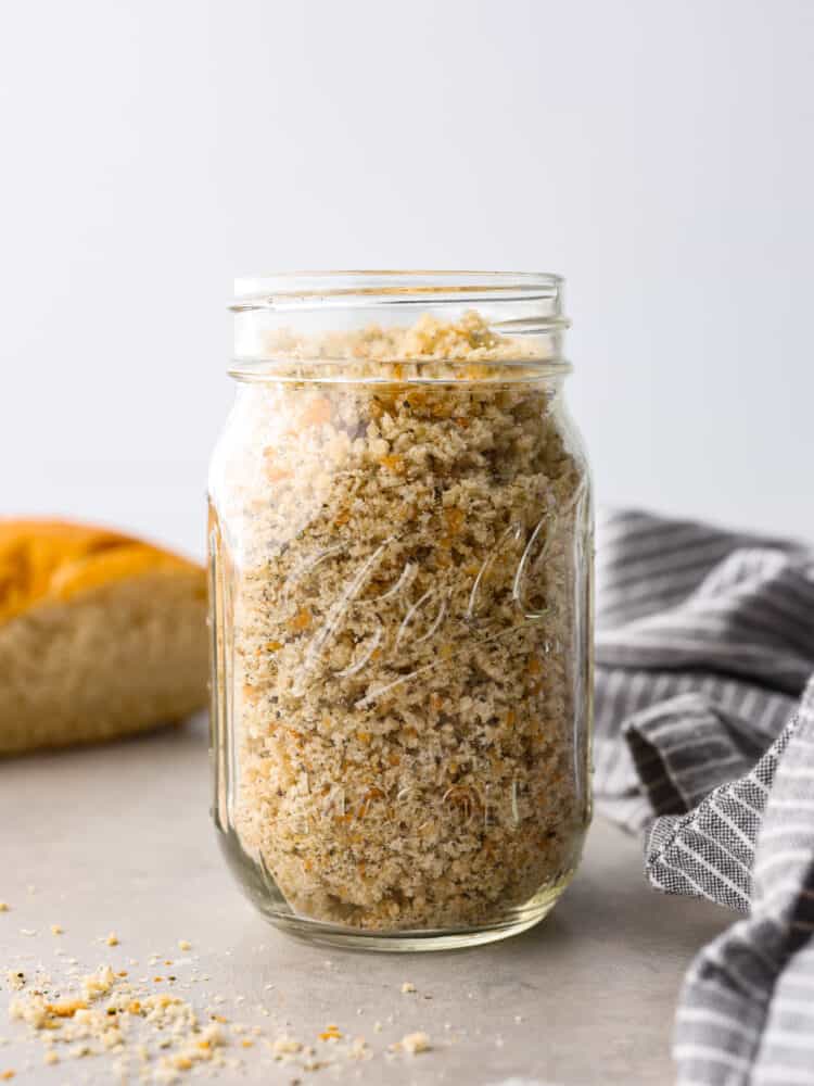 Having homemade breadcrumbs on hand is a great way to add extra flavor and texture to your meals. They're free of preservatives and are seasoned with delicious Italian herbs to level up all of your favorite recipes! A glass jar filled to the brim with homemade breadcrumbs.