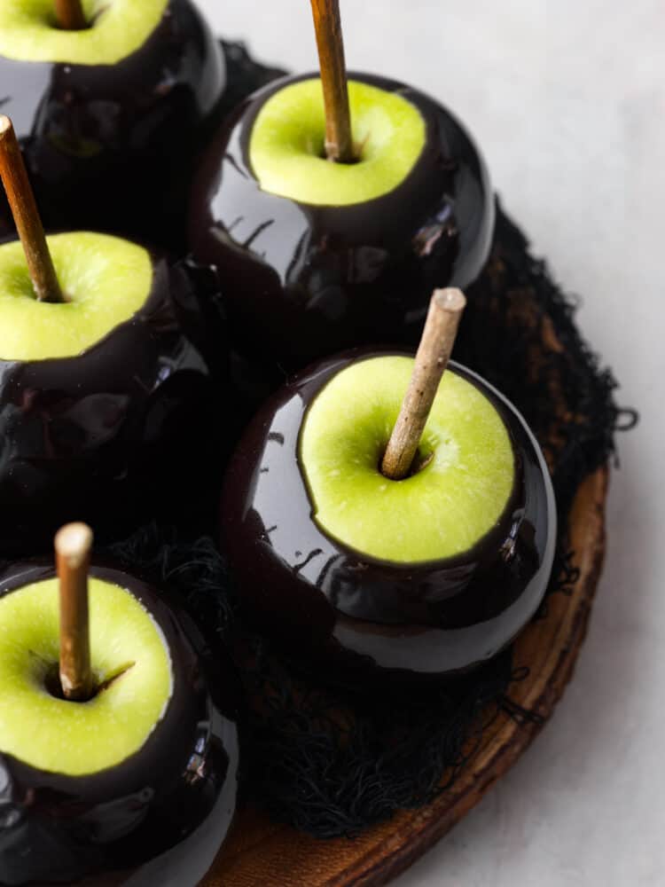 Poison caramel apples are the perfect haunted Halloween treat! The glossy black color not only looks spooky but it tastes absolutely amazing! It's definitely a dessert that will be sure to impress your guests!