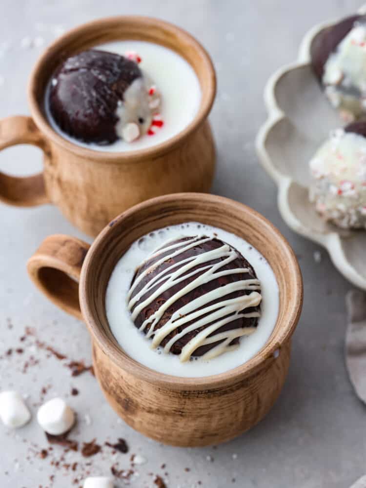 Once you try making hot chocolate with hot chocolate bombs, you’ll never go back. Your hot chocolate will turn out creamy, rich, and packed with deep chocolatey flavor every time! These are great for gift-giving or enjoying on a chilly evening with the family. A hot chocolate bomb in a mug filled with milk.