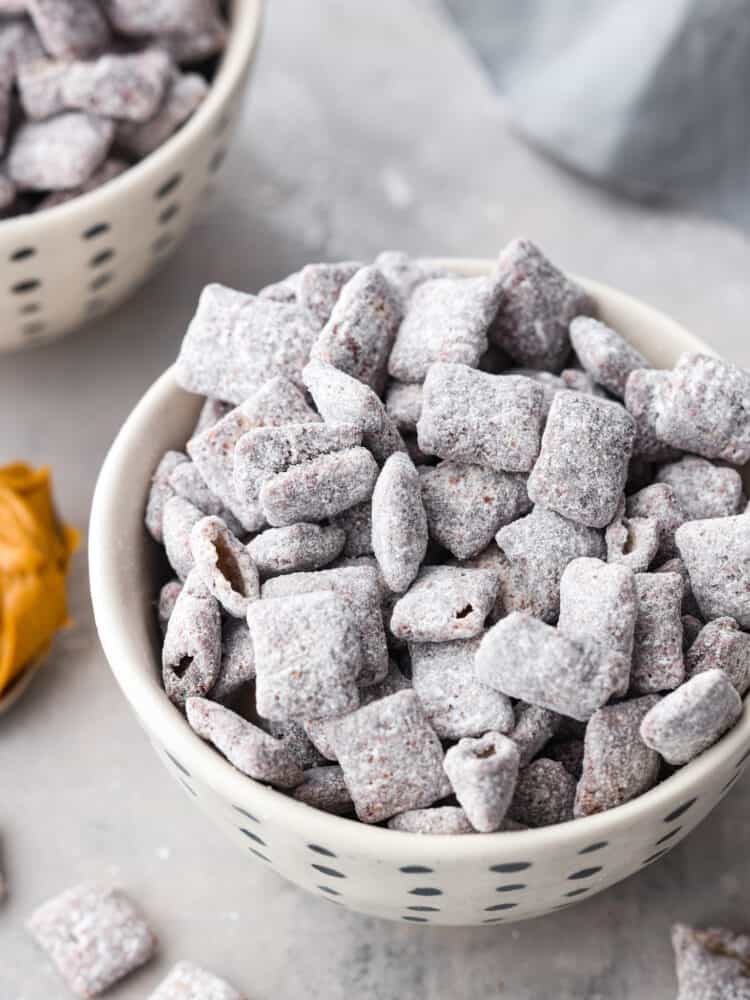 If you crave a peanut butter and chocolate snack with less calories, these Skinny Muddy Buddies are your new best friend! They taste just as good as the muddy buddies you remember, without the guilt. Skinny muddy buddies in a bowl.