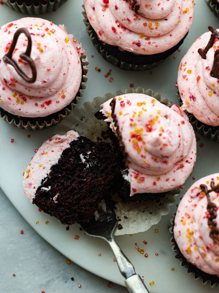 Show your sweetheart how much you care with these decadent chocolate and strawberry Valentine's Day Cupcakes. They are simple to make for parties and gatherings and are always a hit. One of the Valentine's Day cupcakes cup open.