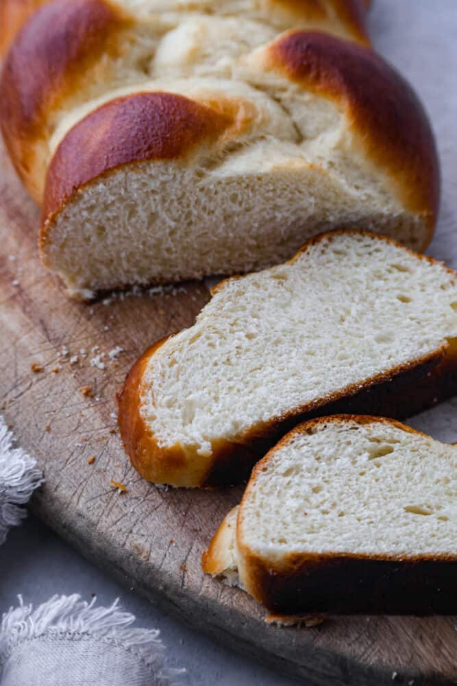 If you want to start making more bread at home, this brioche bread is the perfect place to start! Not only is it beautiful, fluffy, and super delicious, it's also really easy to make. This bread is perfect for sandwiches, French toast, or just eating plain! Brioche bread slices.