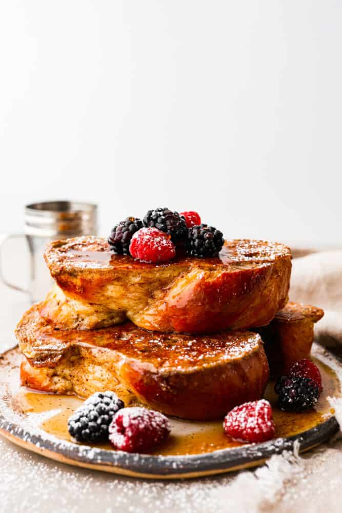 Move over regular French toast, there's a new brunch boss in town and it's made with brioche bread! With its buttery richness and pillowy texture, it's like biting into a cloud of happiness. Trust me, once you've had brioche French toast, there's no going back to the basic stuff. Itโs breakfast, elevated! 2 slices of brioche French toast stacked on top of each other.