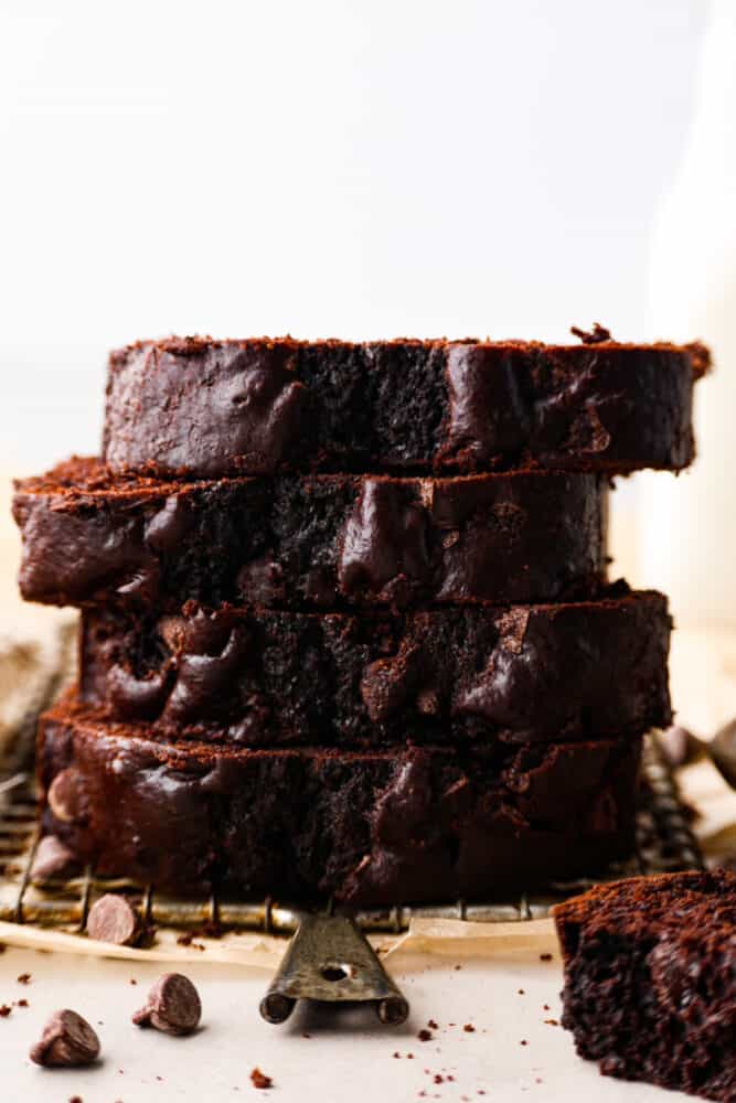 This bread is every chocolate loverโs dream! Moist and soft with deep chocolatey flavor, you wonโt be able to stop at one slice! 4 pieces of bread stacked on top of each other.