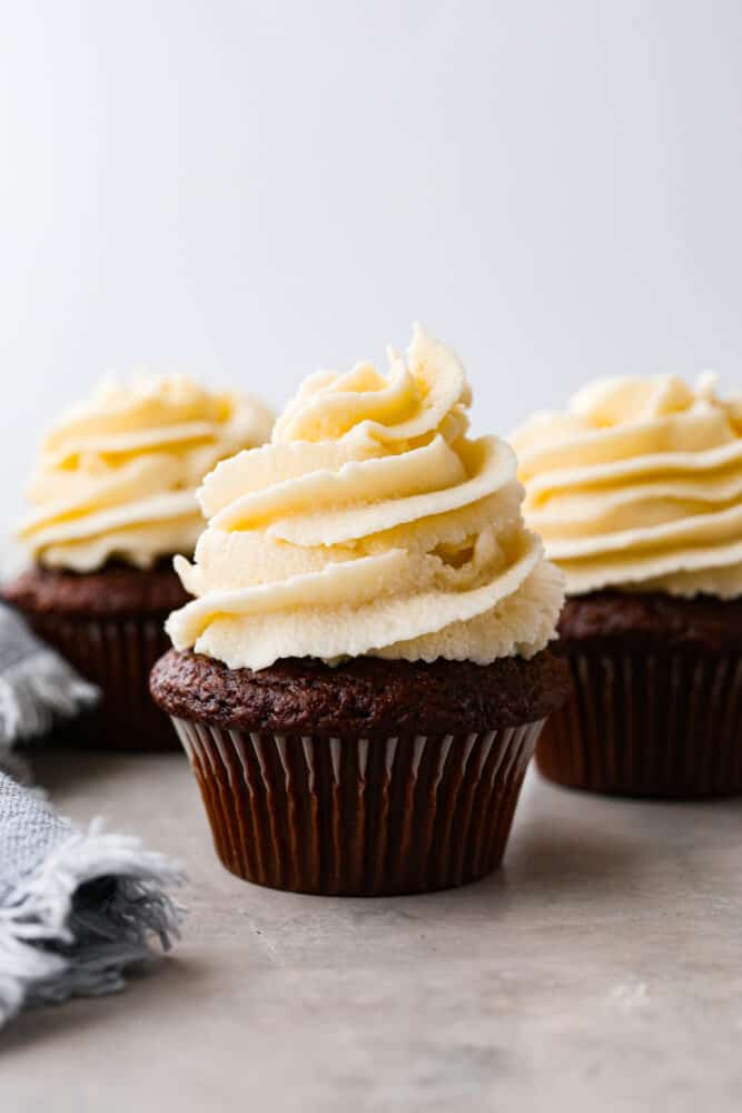 Ermine frosting, sometimes called roux frosting or flour frosting, is made by cooking flour, sugar, and milk. Never heard of it? I hadn't either, but it's actually a super light and fluffy frosting (that does NOT taste flour-y at all) that reminds me of sweet whipped cream. You are going to love this unique frosting! Ermine frosting on top of a cupcake.