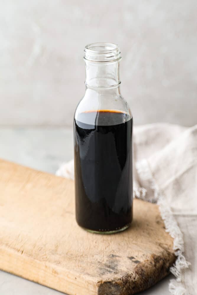 Making your own homemade blend of vanilla extract is quick and easy. Trust me, it will take all of your recipes to the next level! Plus, it only takes 2 simple ingredients to whip up! A bottle of homemade vanilla extract, completely extracted.