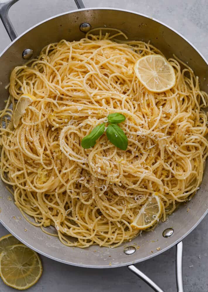 Pasta al limone is a really simple and classic Italian dish of long noodles and a parmesan and lemon topping. It is covered in melted butter and tangy lemon, and is the perfect thing to cook for dinner when you don't know what to make! Pasta al limone in the pan.