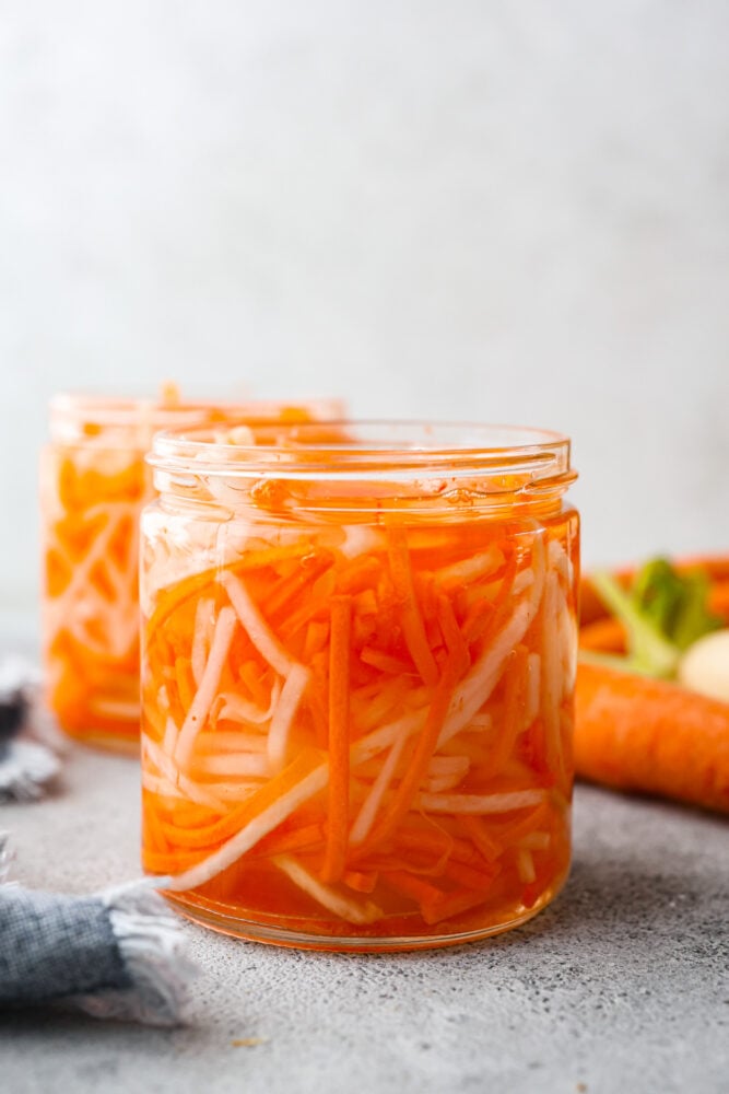 My pickled carrots and daikon are the zesty upgrade your meals didn’t know they needed! Made with rice vinegar, they’re a little sweeter and less sharp than typical pickled veggies. Pickled carrots in a jar.