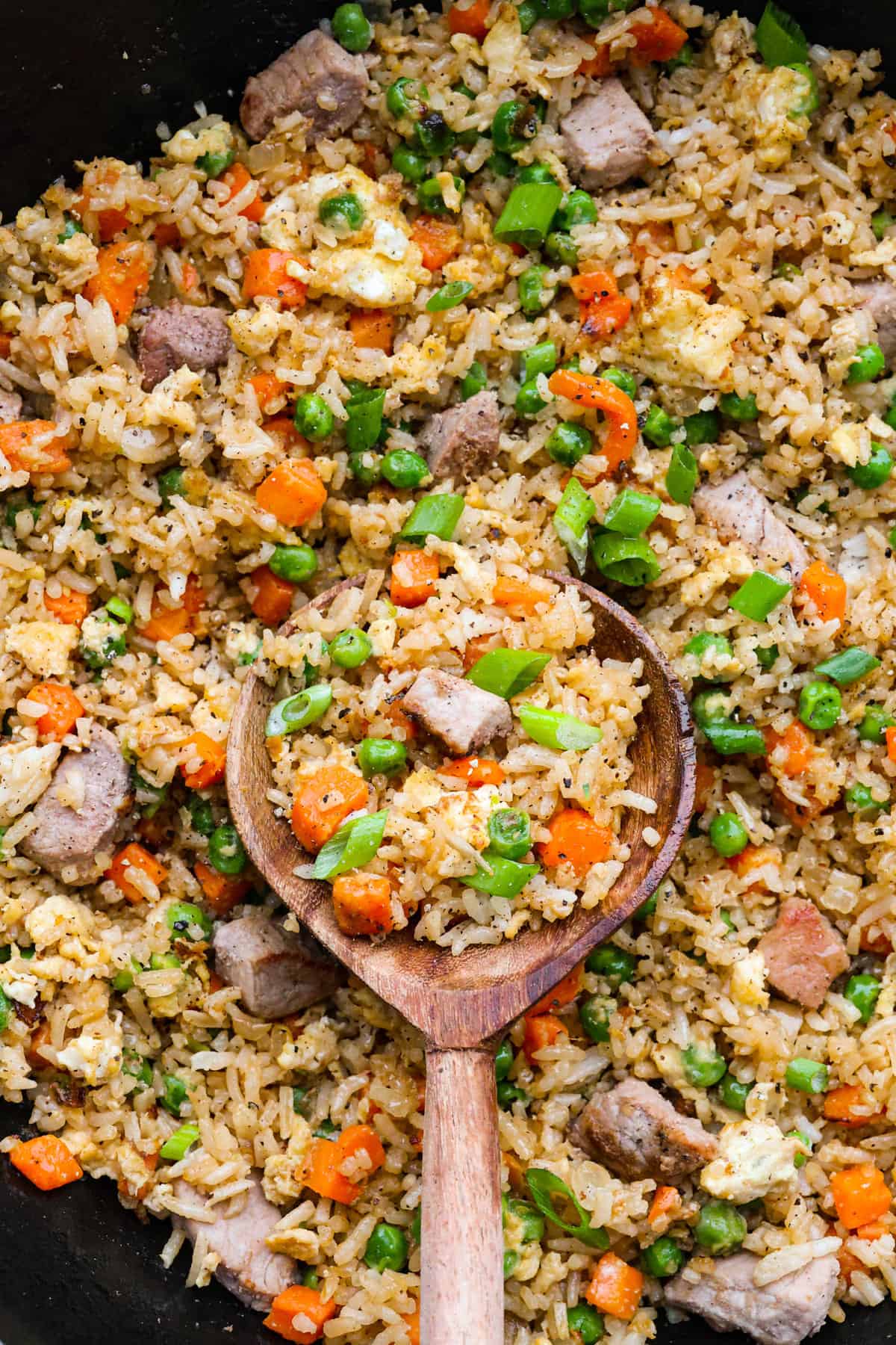 You guys know how I feel about fried rice, itโs my go-to for leftover rice and whatever meatโs in the fridge. Pork Fried Rice is savory and satisfying. With tender pork, fluffy eggs, and veggies all in one pan, itโs the ultimate weeknight win. Everything mixed together and seasoned with salt and pepper.