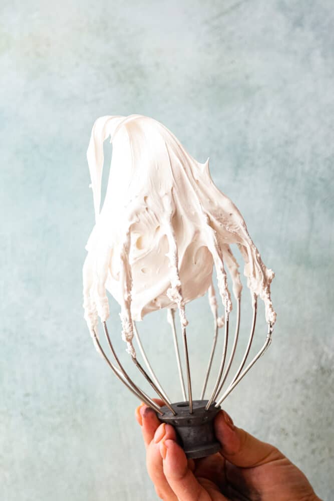 Life is short, make some marshmallow fluff! It’s like a cloud made of sugar and is the ultimate sweet treat. It works as a great topping, cake filling and fruit dip, but is also perfect for eating straight from the jar. I won’t tell! Marshmallow fluff on a whisk attachment.