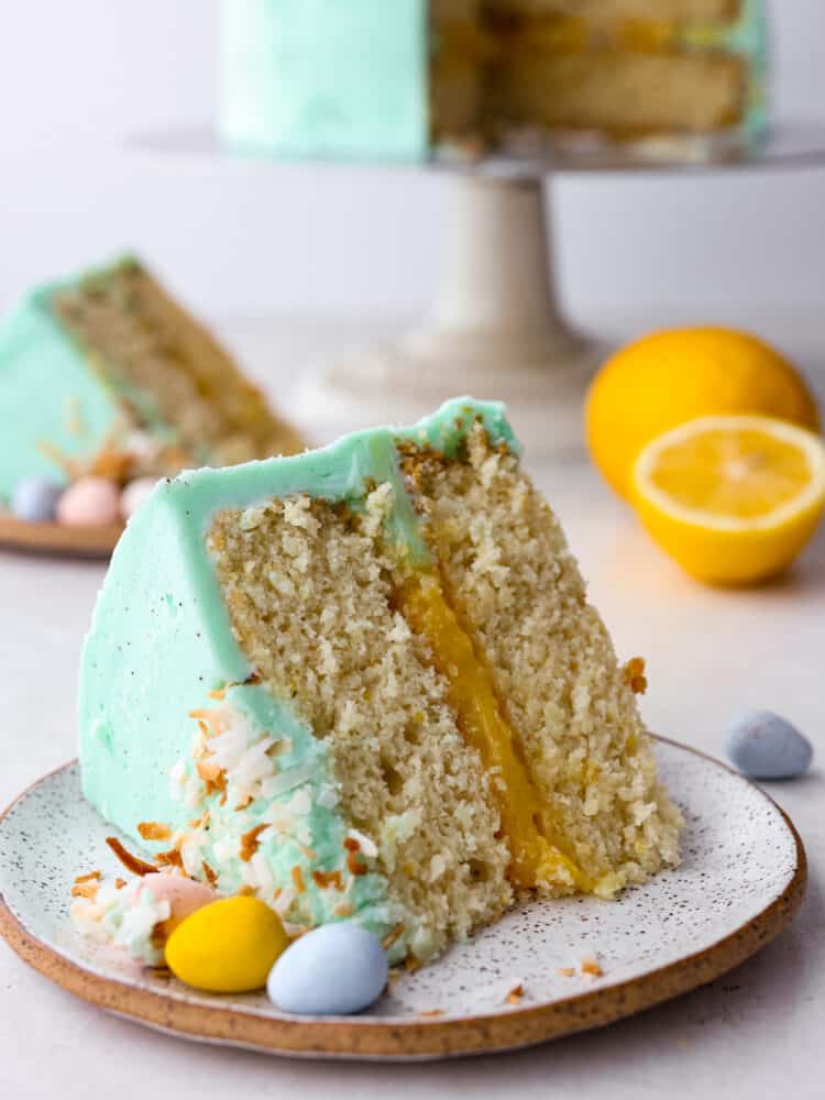 This Easter cake is absolutely divine! A perfectly moist cake with a lemon curd filling and a delicious buttercream frosting will be sure to get a "WOW!" From all of your guests this Easter season!