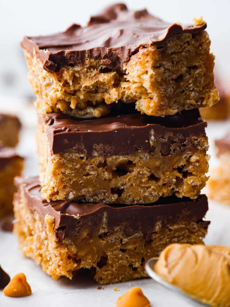 These Special K Bars are a delicious combination of smooth peanut butter, crispy Special K cereal, and a rich chocolate-butterscotch topping. This quick and easy recipe is a sweet treat that will leave you craving more. A close up of a stack of Special K bars.